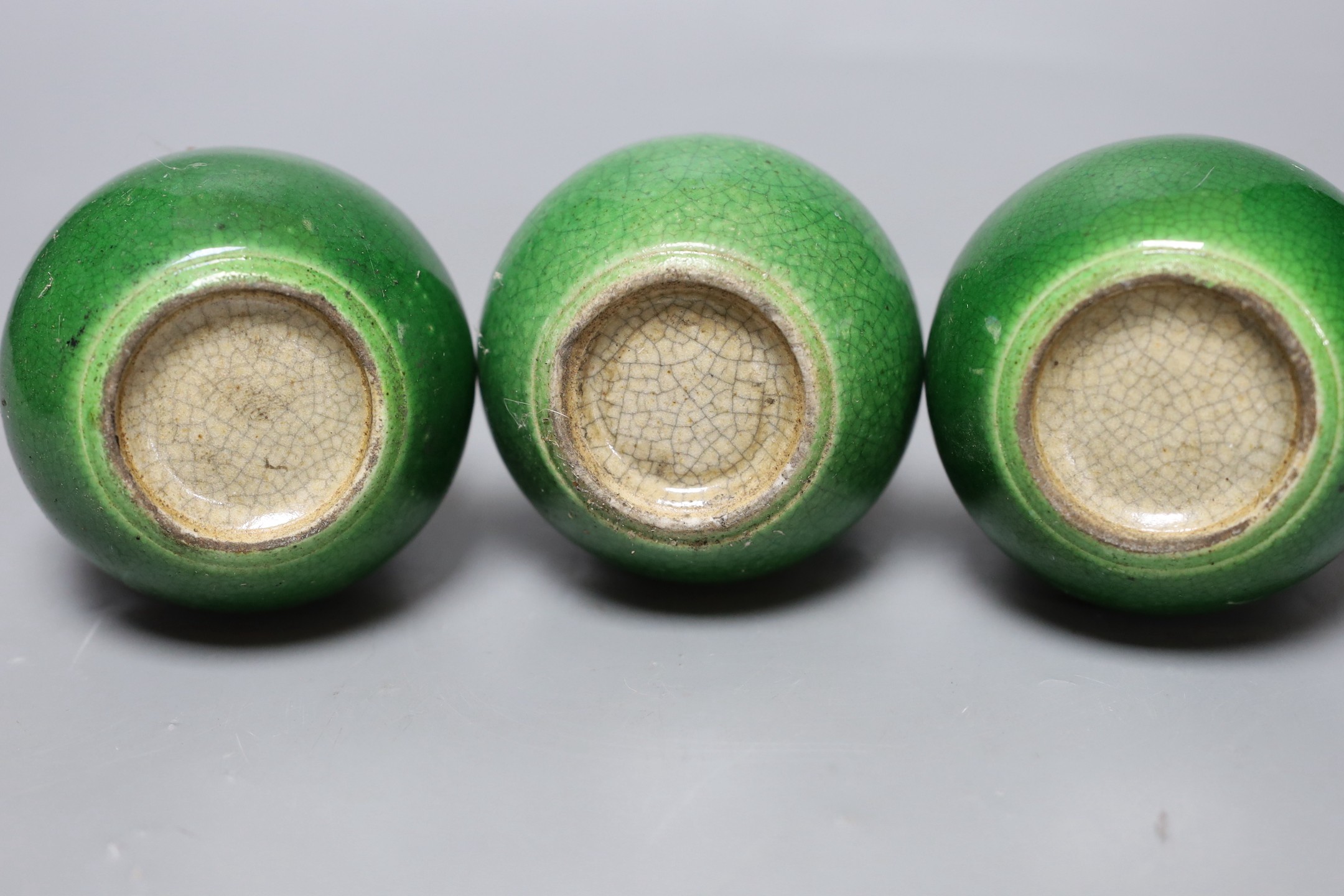 Three Chinese green crackle glazed double gourd vases, 15cm
